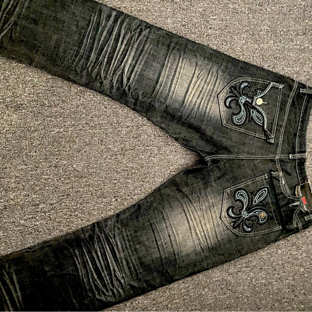 Acid washed black jeans with embroidery